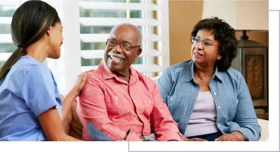 A man and woman sitting on the couch.